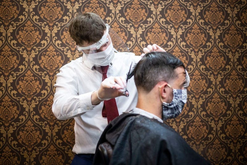 Barber wearing protective gear