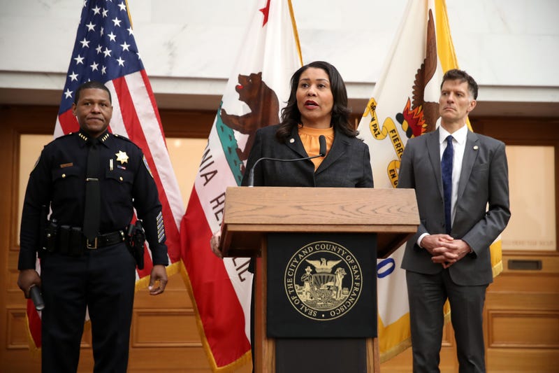 San Francisco Mayor London Breed (C) speaks during a press conference as San Francisco police chief William Scott (L) and San Francisco Department of Public Health director Dr. Grant Colfax (R) look on at San Francisco City Hall on March 16, 2020.