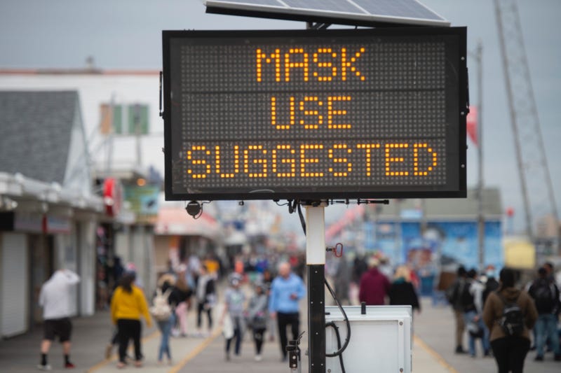 A sign placed on the boardwalk states "MASK USE SUGGESTED" on May 24, 2020 in Wildwood, New Jersey.