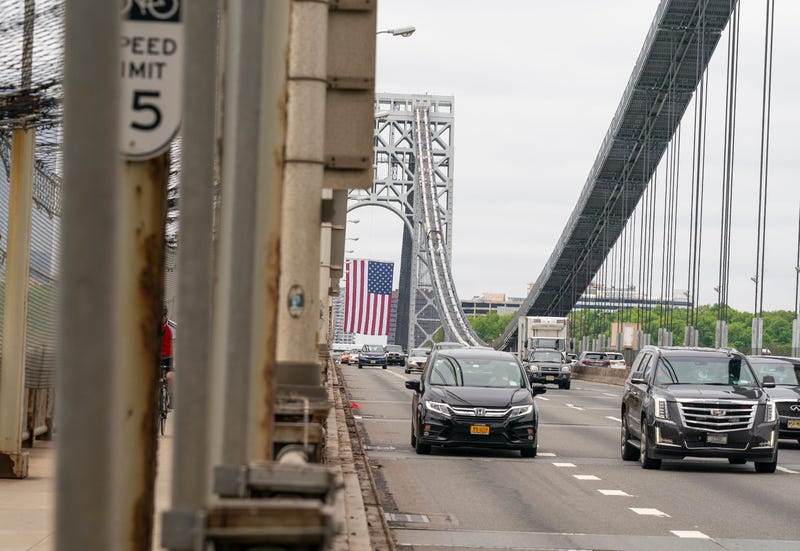 View of roadways of George Washington Bridge with huge American Flag hanging on New Jersey side tower during Memorial Day in NYC amid COVID-19 pandemic.