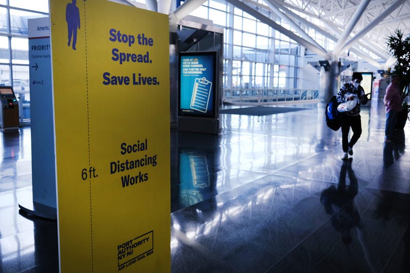 Passengers walk through a near empty John F. Kennedy Airport (JFK) due to the ongoing cutbacks in travel because of the coronavirus on April 16, 2020 in New York City.