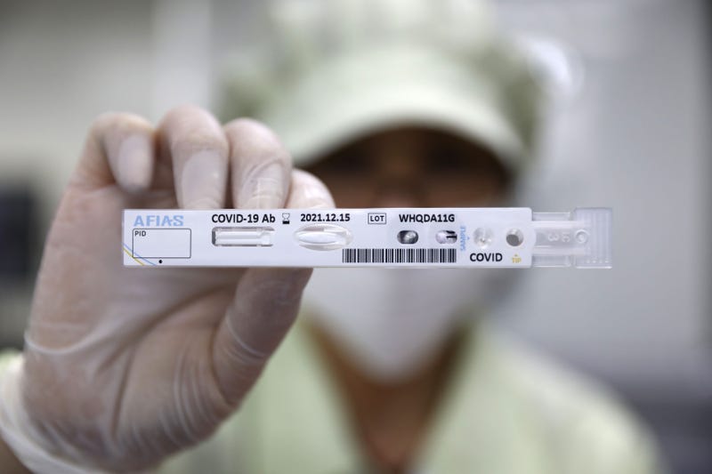 CHUNCHEON, SOUTH KOREA - APRIL 17: An employee holds up an AFIAS Covid-19 Ab testing kit used in diagnosing the coronavirus (COVID-19) at the Boditech Med Inc. headquarters on April 17, 2020 in Chuncheon, South Korea.