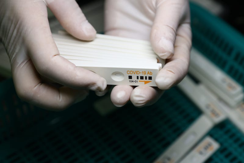 CHUNCHEON, SOUTH KOREA - APRIL 17: An employee holds up an Ichroma Covid-19 Ab testing kits used in diagnosing the coronavirus (COVID-19) at the Boditech Med Inc. headquarters on April 17, 2020 in Chuncheon, South Korea.