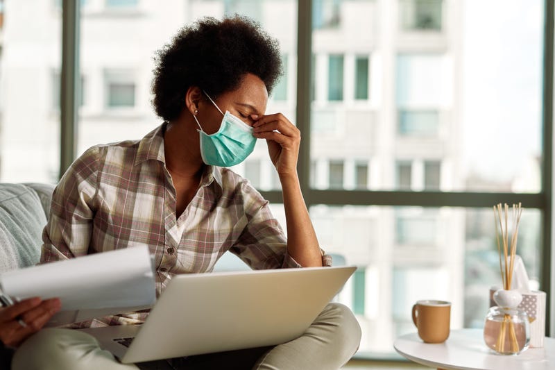 A Black woman working from home during pandemic.