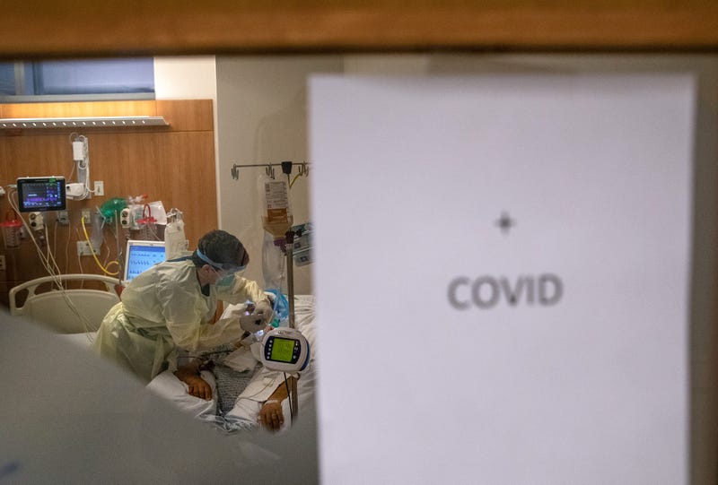 A nurse wearing personal protective equipment (PPE), tends to a COVID-19 patient in a Stamford Hospital intensive care unit (ICU), on April 24, 2020 in Stamford, Connecticut.