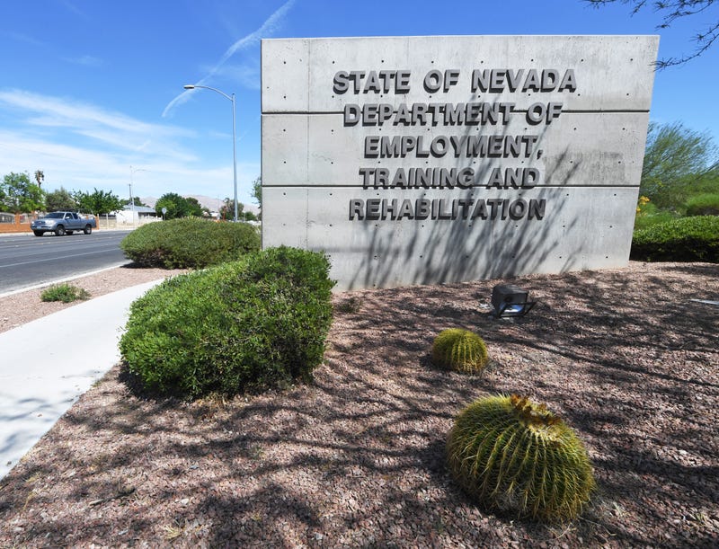 A vehicle drives by a sign at the State of Nevada Department of Employment, Training and Rehabilitation (DETR) as the coronavirus continues to spread on April 28, 2020 in Las Vegas, Nevada.