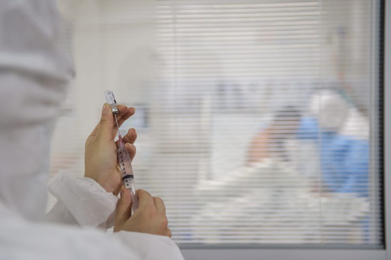 A medical team employee prepares vaccine at the ICU of Mater Dei hospital amid the coronavirus (COVID-19) pandemic on June 23, 2020 in Belo Horizonte, Brazil.