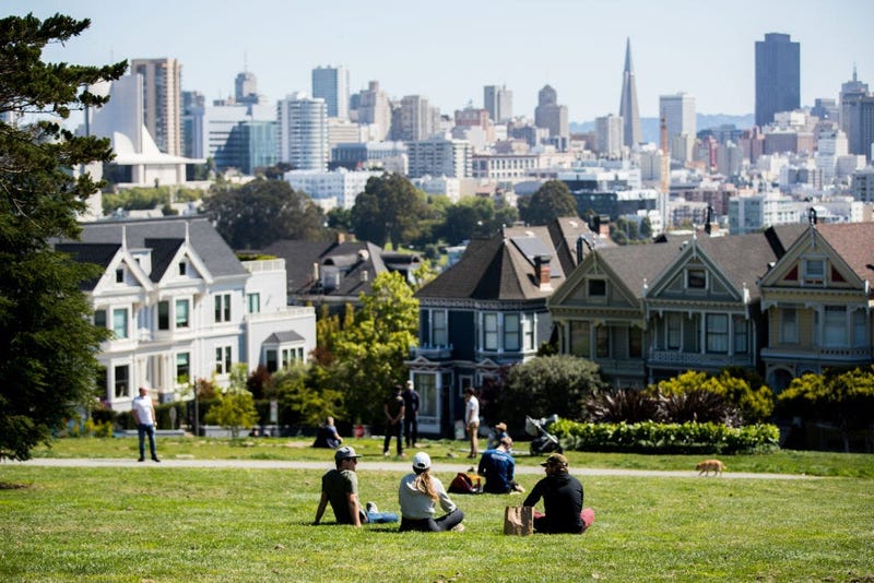 People Sit in Alamo Square Park during Shelter in Place Orders