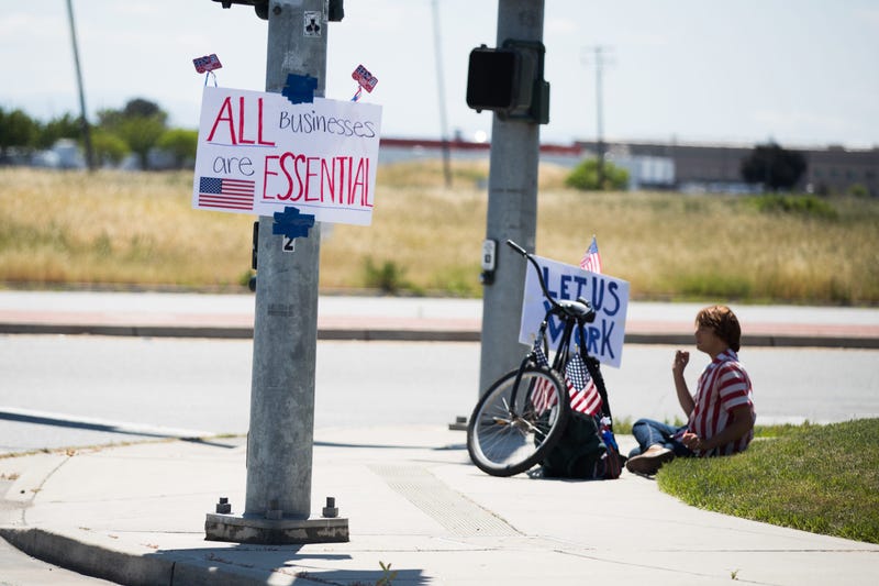 GILROY, CALIFORNIA - MAY 03: A man protests California's stay at home order during the coronavirus pandemic on May 03, 2020 in Gilroy, California.