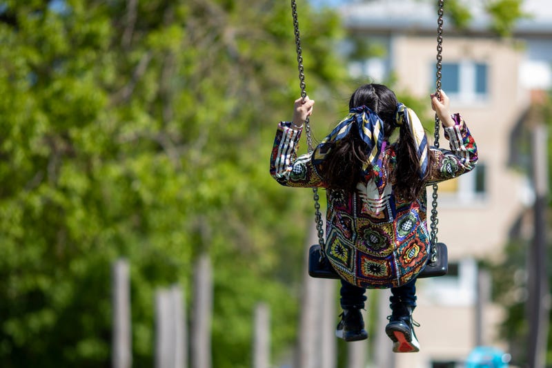 BERLIN, GERMANY - MAY 06: A girl swings at re-opened playground during the coronavirus crisis on May 06, 2020 in Berlin, Germany.