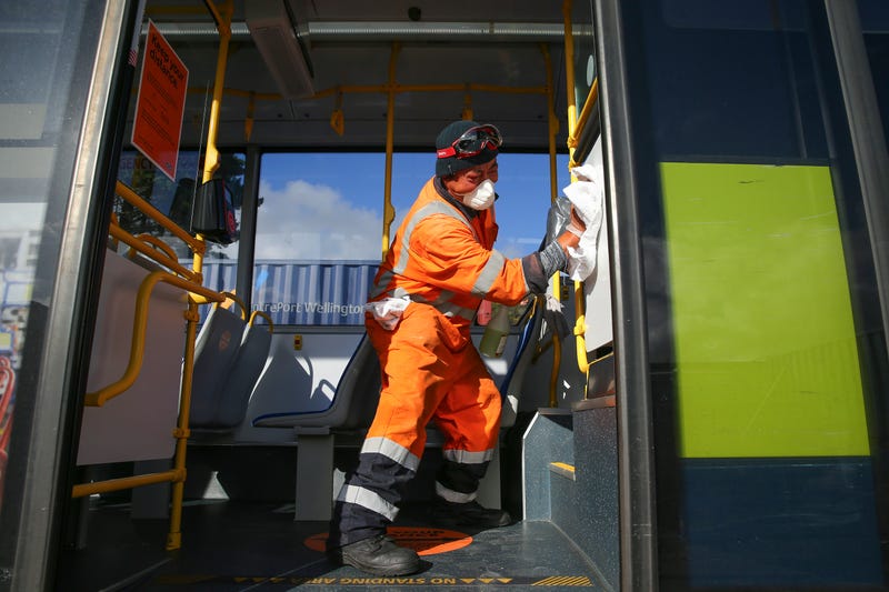 Senior Yard Supervisor Lipi Vitolio disinfects the interior surface of a bus at Tranzit Bus Depot on May 09, 2020 in Wellington, New Zealand.