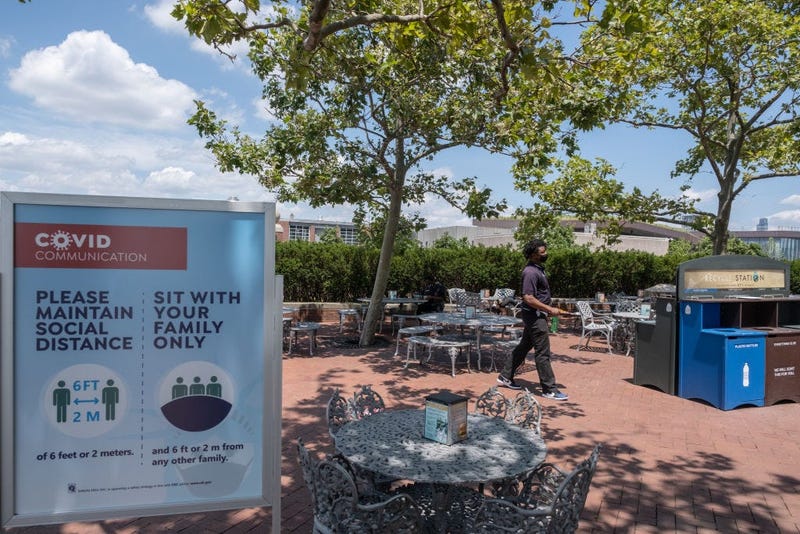 A man wearing a protective mask walks in the cafeteria as it reopened on Liberty Island on July 20, 2020