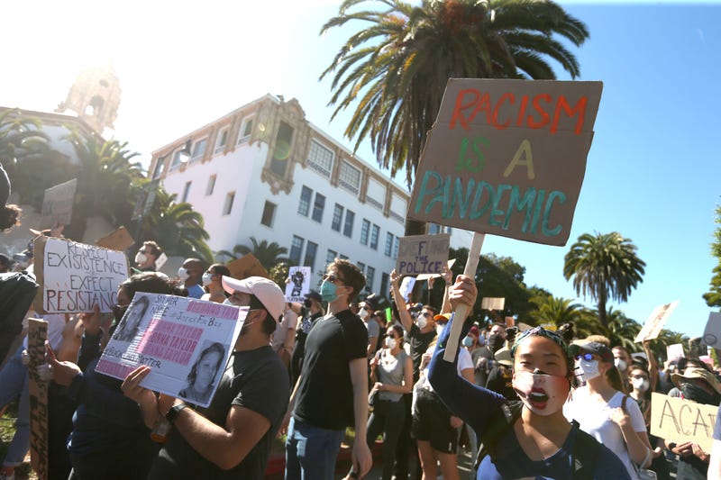 Protesters hold signs and chant during a demonstration to honor of George Floyd on June 03, 2020 in San Francisco, California.