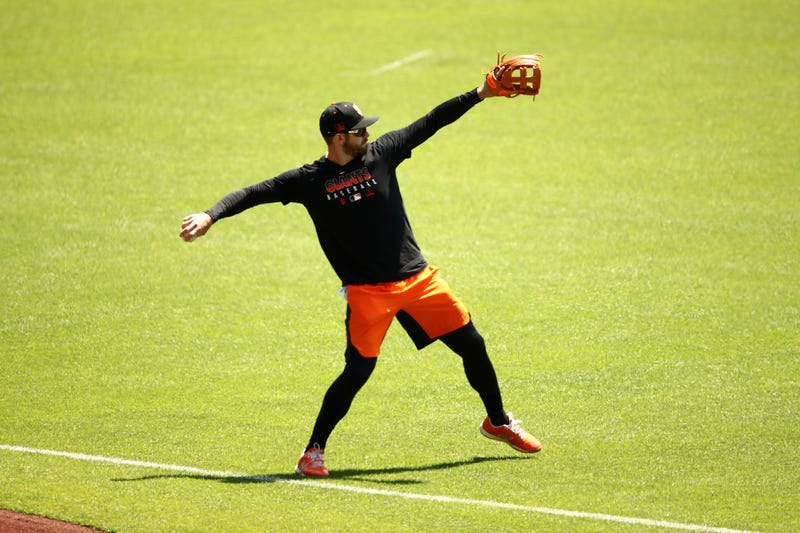 Evan Longoria #10 of the San Francisco Giants plays catch during summer workouts at Oracle Park on July 03, 2020 in San Francisco, California.