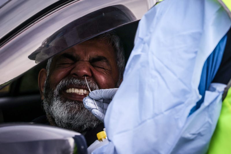 Medical staff at a pop-up COVID-19 testing clinic, perform tests on drivers on July 11, 2020 in the Sydney suburb of Casula, Australia.