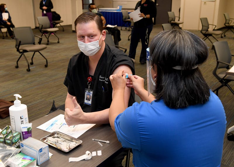 Dr. David Obert gives a thumbs-up after receiving a Pfizer-BioNTech COVID-19 vaccination at University Medical Center of Southern Nevada on December 16, 2020, in Las Vegas, Nevada.