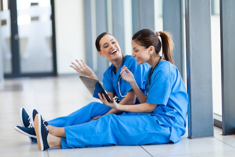 Nurses, Two Nurses, Female, Talking, Tablet, On a Break, Sitting