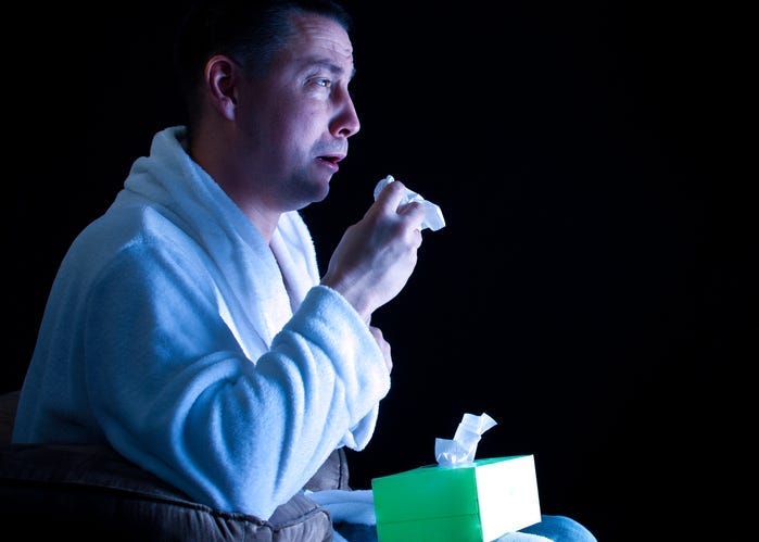 Man Crying While Watching a Movie