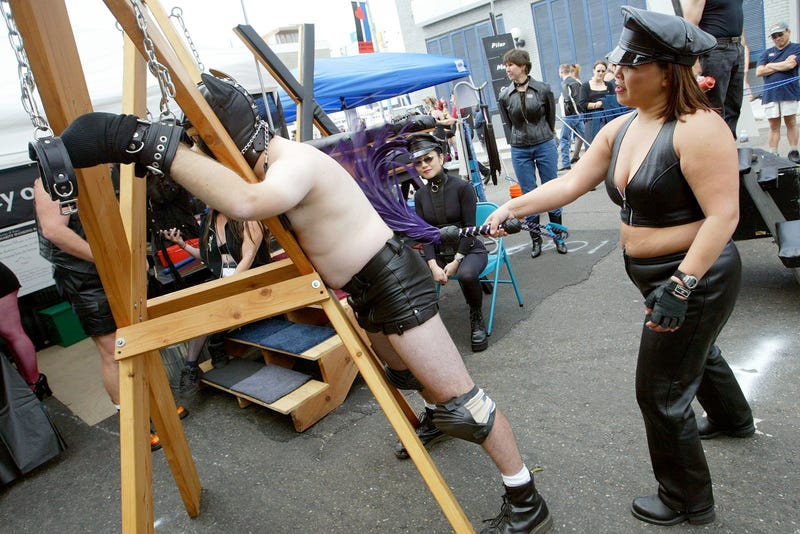 A man is whipped by a woman at the 20th Annual Folsom Street Fair September 28, 2003 in San Francisco, California.