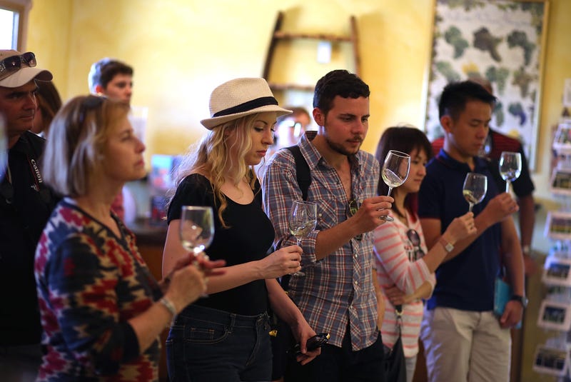 tour group tastes wine at Madonna Estate Winery on August 26, 2014 in Napa.