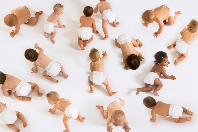Babies crawling around on the floor