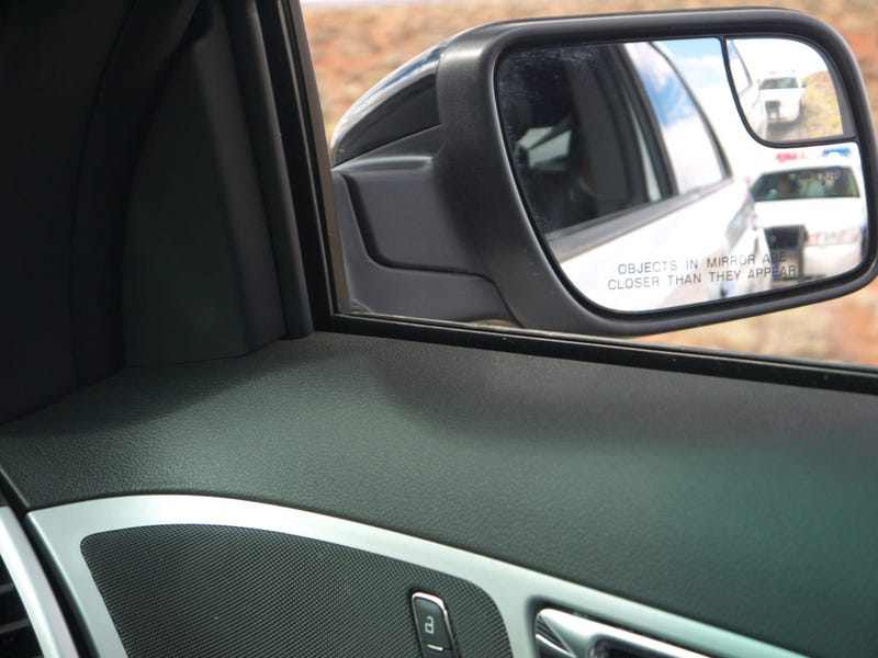 Police in the side-view mirror