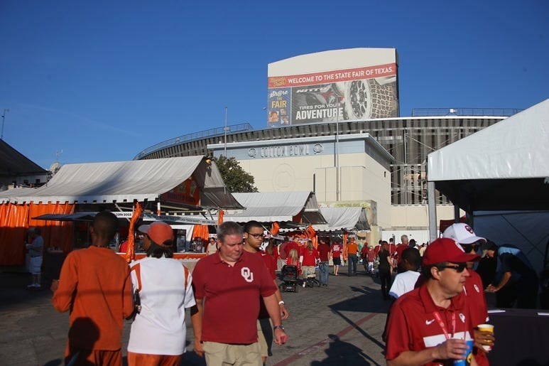 DALLAS, TX - OCTOBER 10: Fans walk through the State Fair of Texas before the 2015 AT&T Red River Showdown between the Texas Longhorns and the Oklahoma Sooners at Cotton Bowl on October 10, 2015 in Dallas, Texas. (