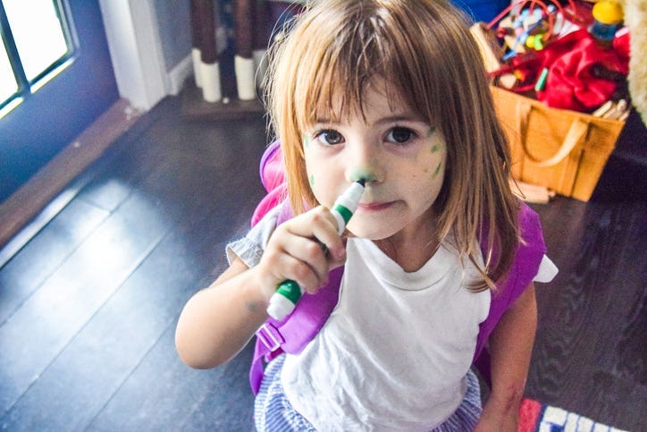 Child Drawing on Their Face
