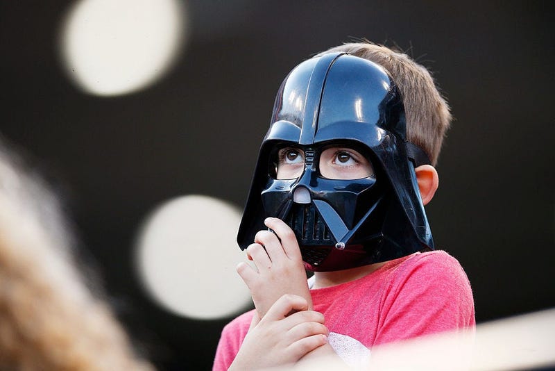 Kid in a Darth Vader mask