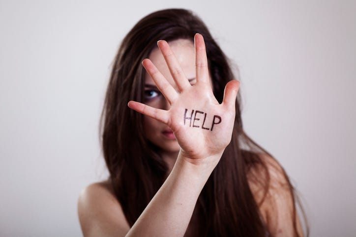 HELP written on hand.HELP written on hand.