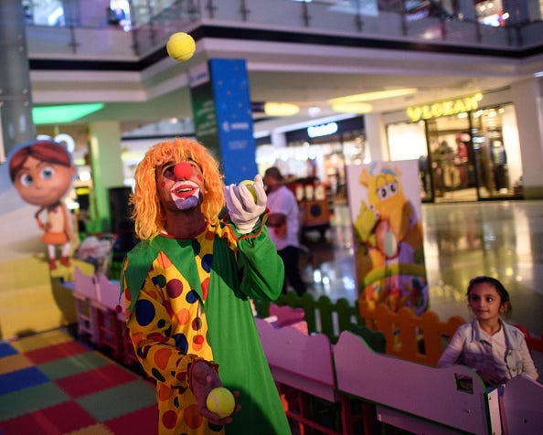 A clown entertains children in a shopping mall on October 25, 2016 in Erbil, Iraq. As the offensive by Iraqi and Kurdish forces to drive Islamic State out of Iraq's second largest city of Mosul continues and despite a recent ISIS attack on nearby Kirkuk,