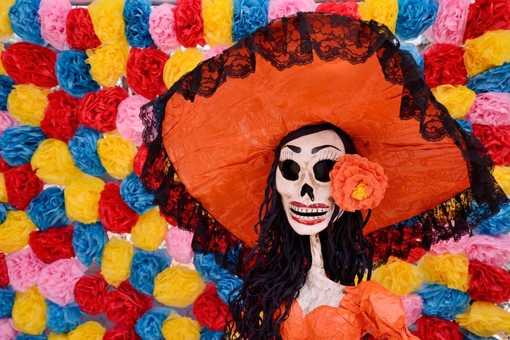 Day of the dead. Traditional Mexican Catrina skeleton against an old wall.