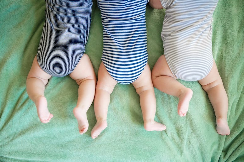 Newborns, Triplets, Lying On Stomach, Blanket