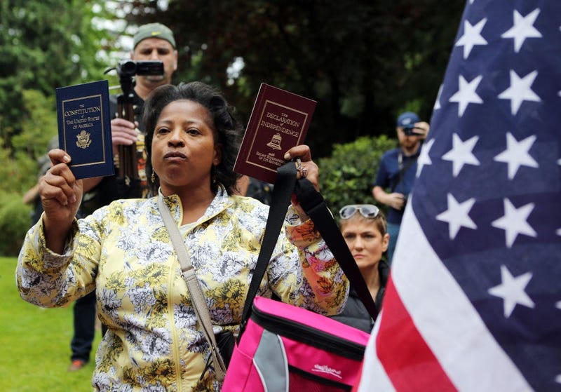 Woman holding Constitution and Declaration