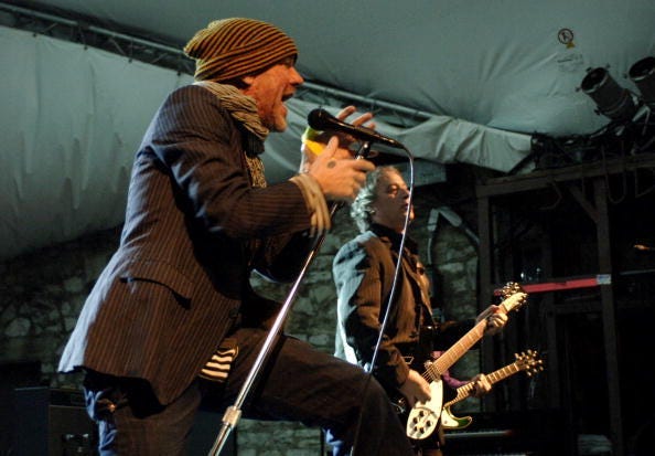 AUSTIN, TX - MARCH 12: Michael Stipe (L) and Peter Buck of REM perform at Stubbs BBQ as part of SxSw 2008 on March 12, 2008 in Austin, Texas. (Photo by Tim Mosenfelder/Getty Images)