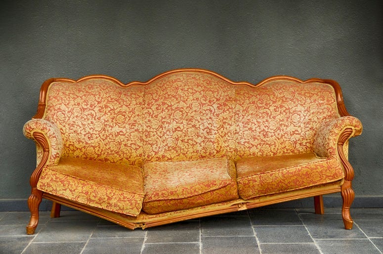 Broken Armchair, Orange, Wall