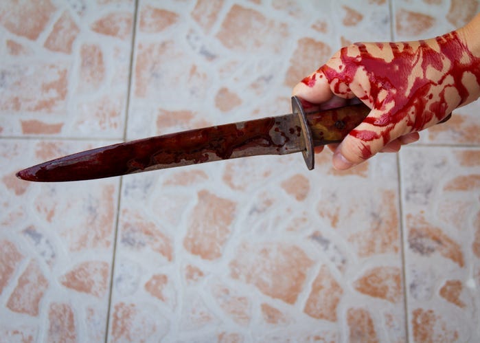 He's holding a bloody knife