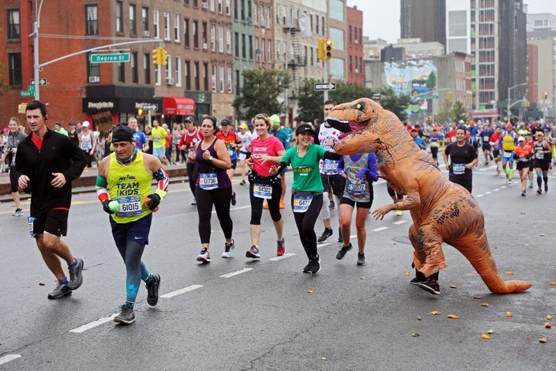 Inflatable T-Rex costume runs in race