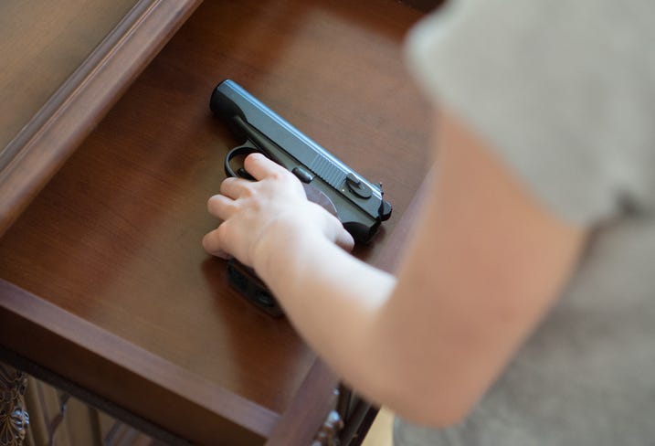 child with firearm
