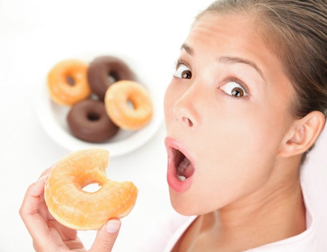 woman eating unhealthy food