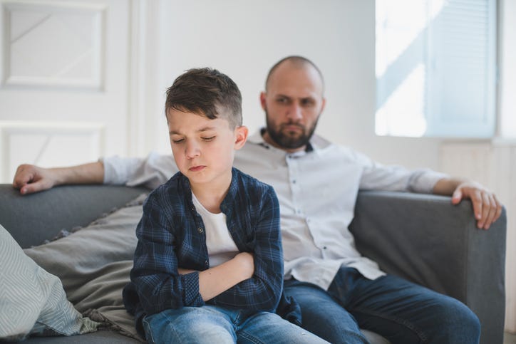 Man Scolding Boy