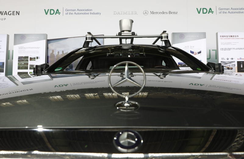 Cameras and gps navigation system gear are placed on a self driving Mercedes car on display at an event to present a project on autonomous driving at former Tempelhof airport on July 10, 2018 in Berlin.