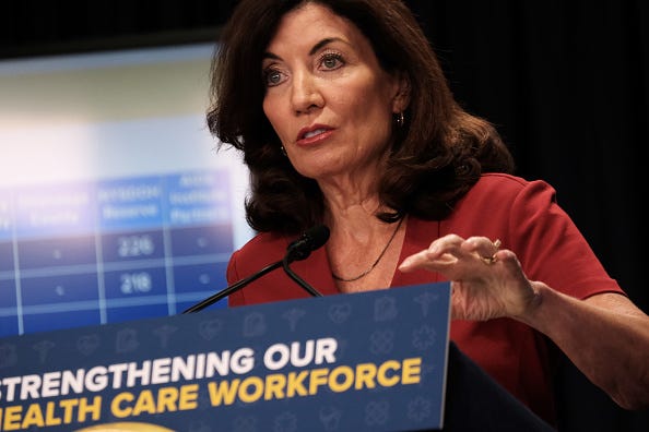 New York Governor Kathy Hochul announces healthcare worker bonus program for frontline workers at a news conference