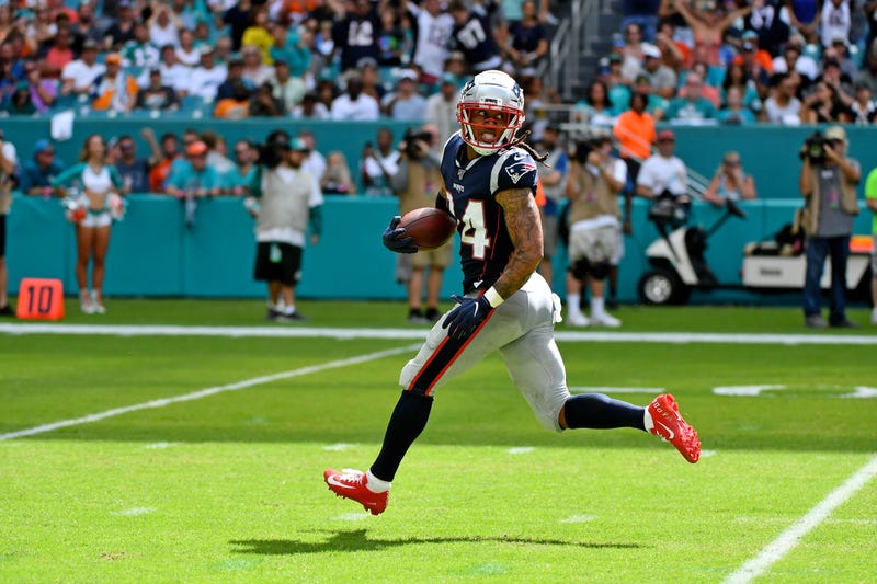 Sep 15, 2019; Miami Gardens, FL, USA; New England Patriots cornerback Stephon Gilmore (24) runs back an interception for a touchdown against the Miami Dolphins during the second half at Hard Rock Stadium. Mandatory Credit: Jasen Vinlove-USA TODAY Sports