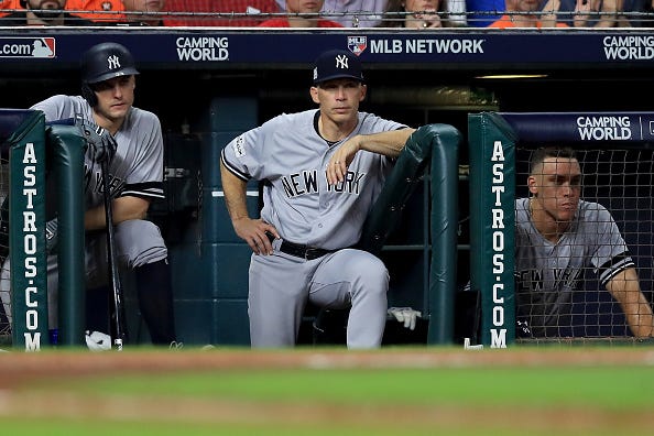 Joe Girardi watches from the dugout in the 2017 ALCS.