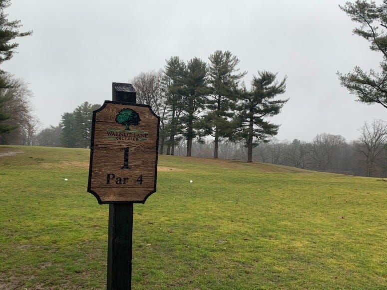 Sign of Walnut Lane Golf Club.