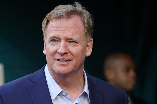 NFL Commissioner Roger Goodell walks on the field before Super Bowl LIV in Miami.
