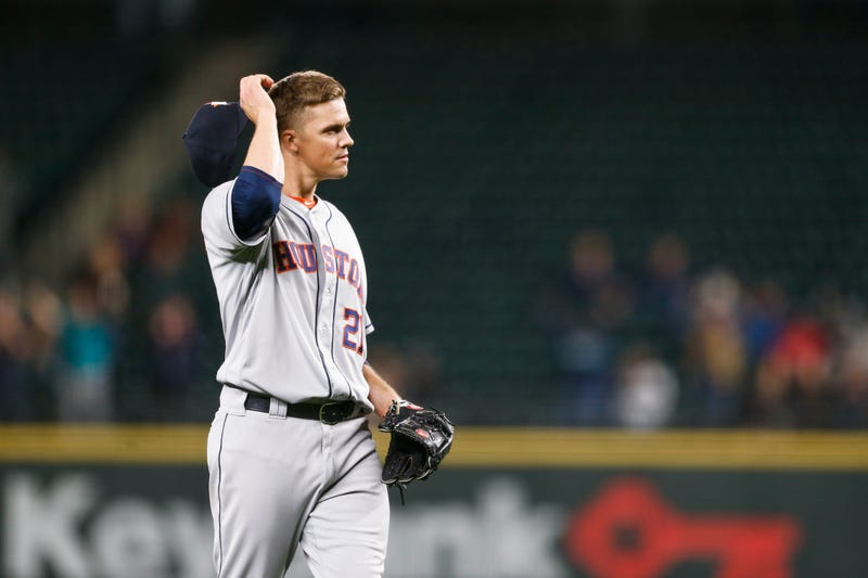 Astros' Zack Greinke reacts after losing his no-hit bid.