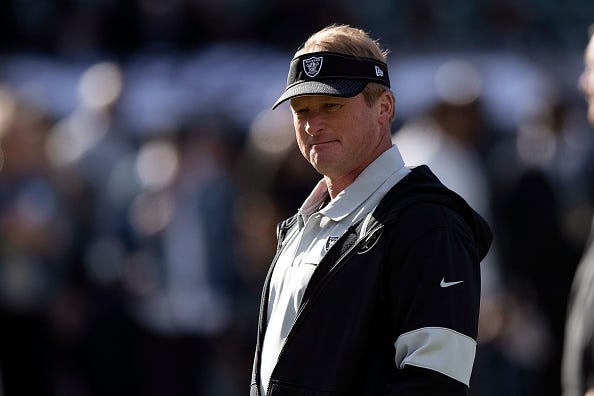 Jon Gruden looks on from the Raiders sideline.