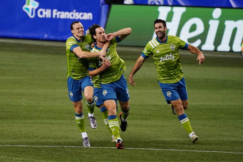Sounders FC celebrate winning goal scored by Gustav Svensson